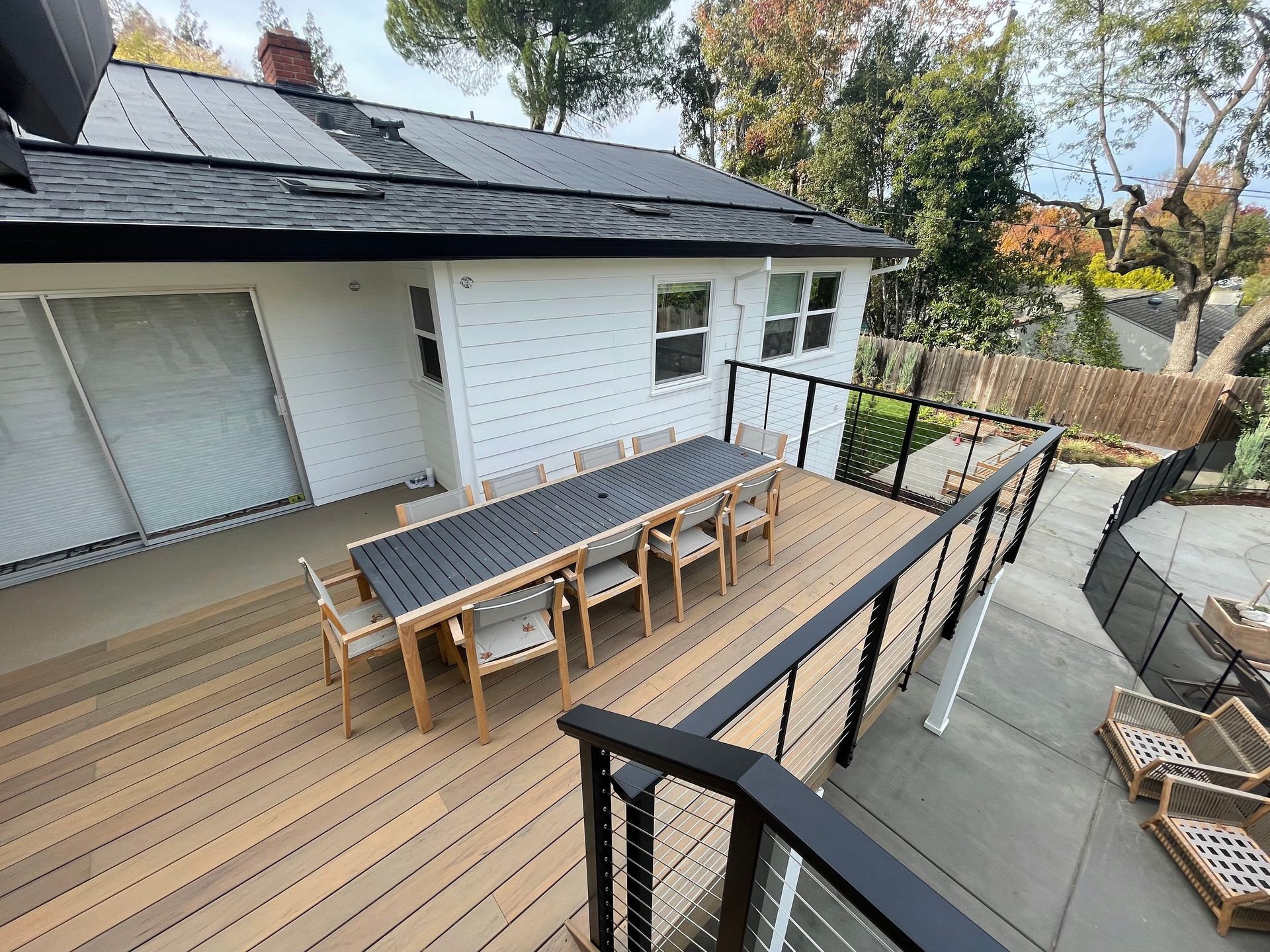 new railing with metal wiring decoration around wood decking