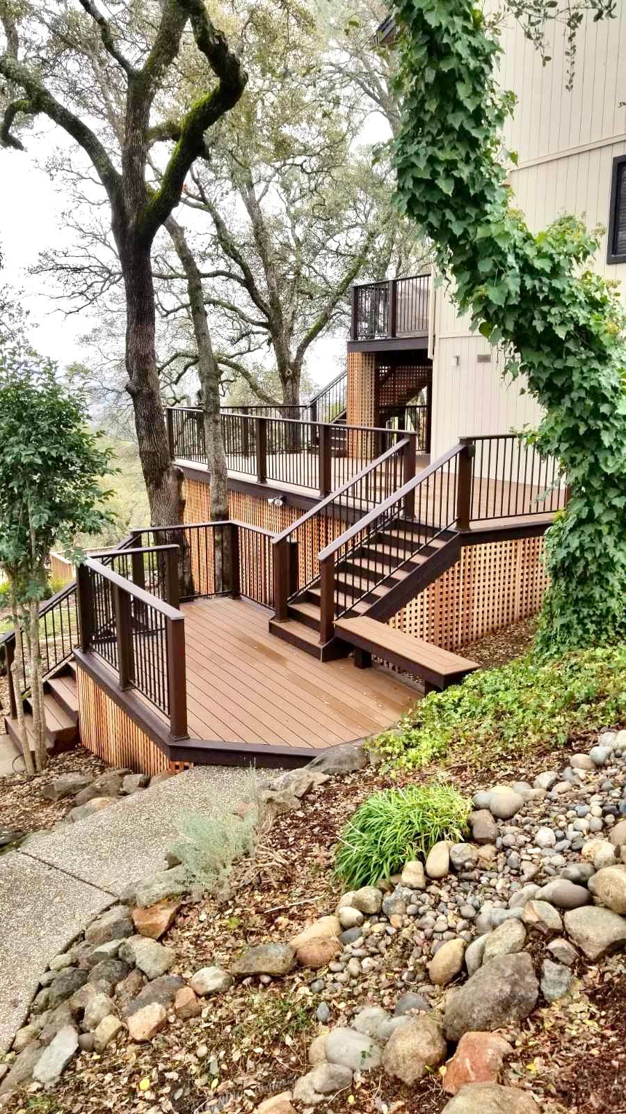 multi level decks with stairs leading to new walkway