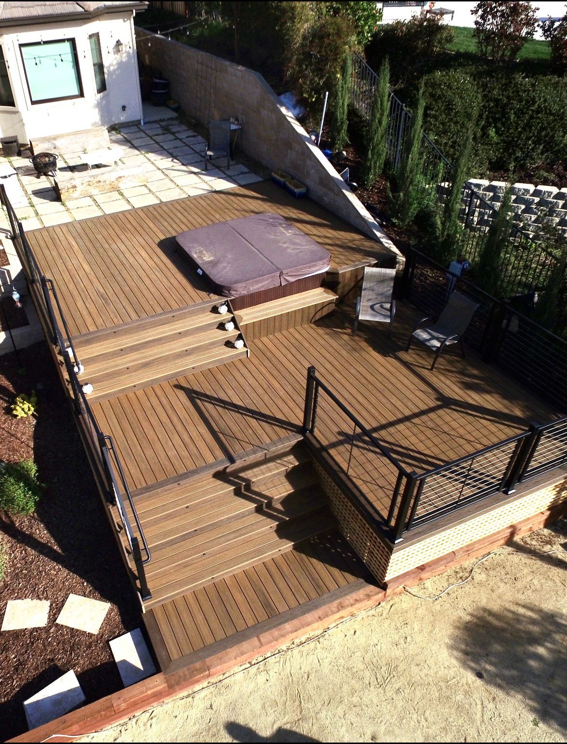 three tiered black colored metal railing with wire decorations