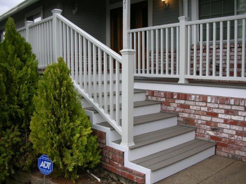 white deck railing with large posts and caps