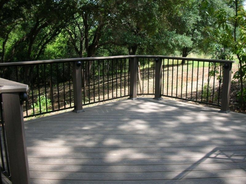 wood deck railing around deck with metal black posts