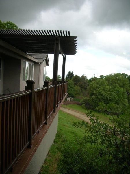 view from the outside of new wood deck railing