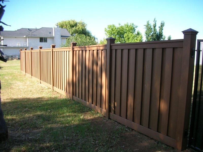 new brown fence with posts