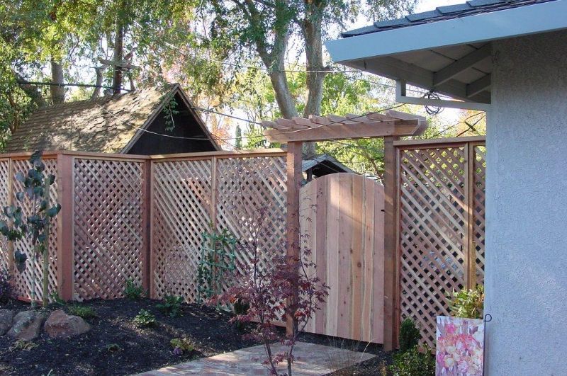light wood lattice fence with light wood gate