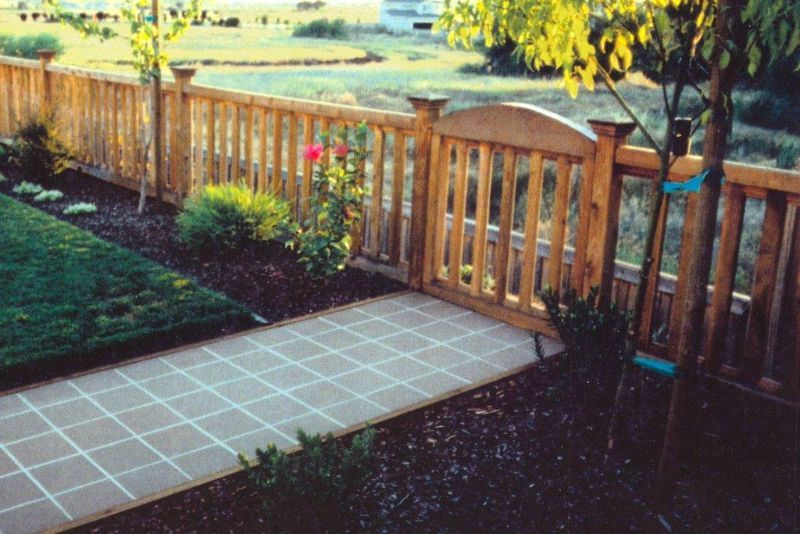 short wood fence in the front yard with custom gate