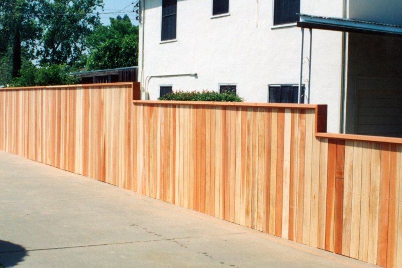 light wood fence with different height elevations