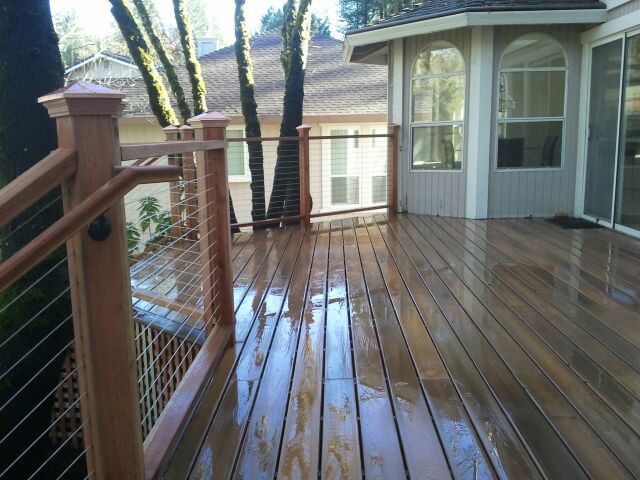 newly installed light wood Deck Railings