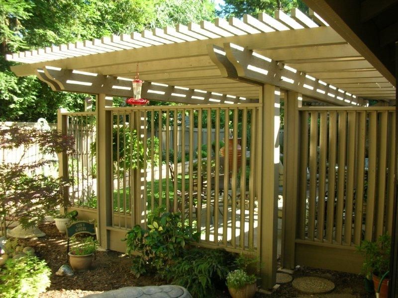 new pergola providing shade area in the backyard