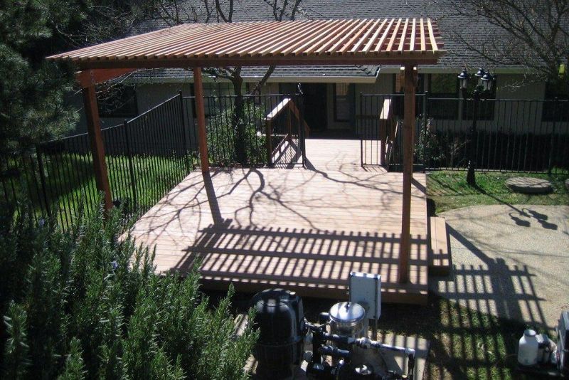 brown colored pergola covering entertainment space