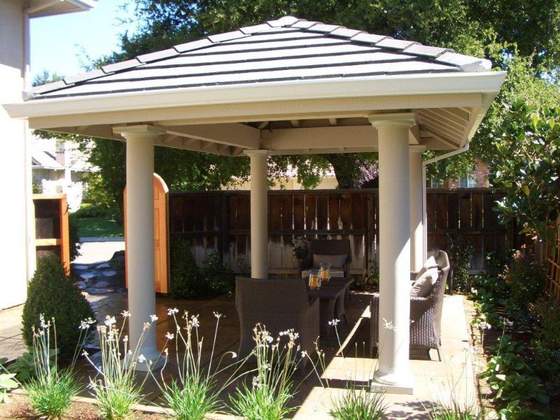 Gazebo in the backyard with patio furniture