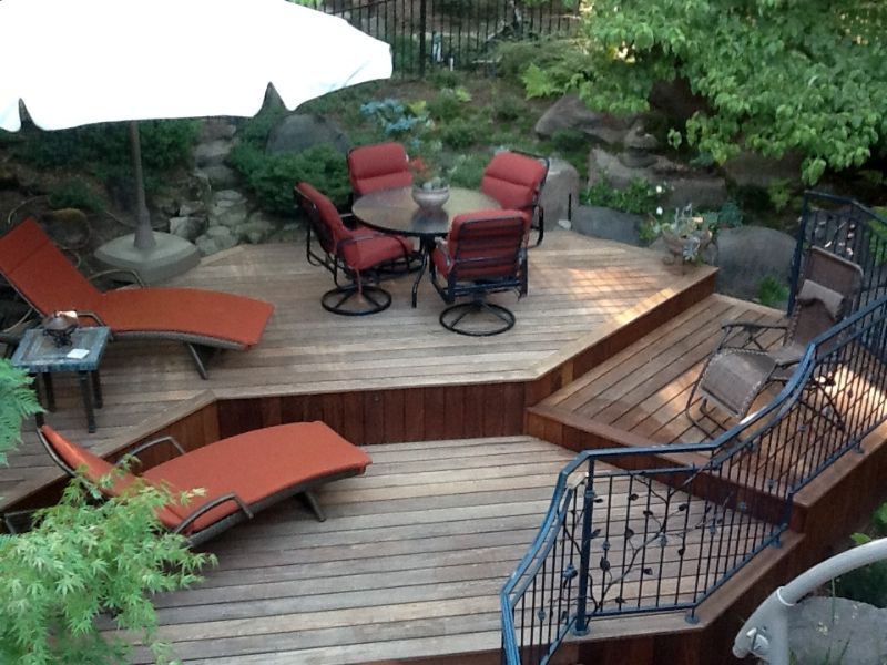 backyard decking installed with patio furniture