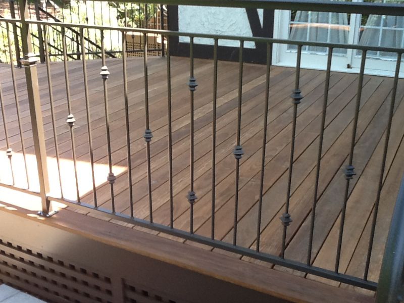 wrought iron poles inside black deck railing