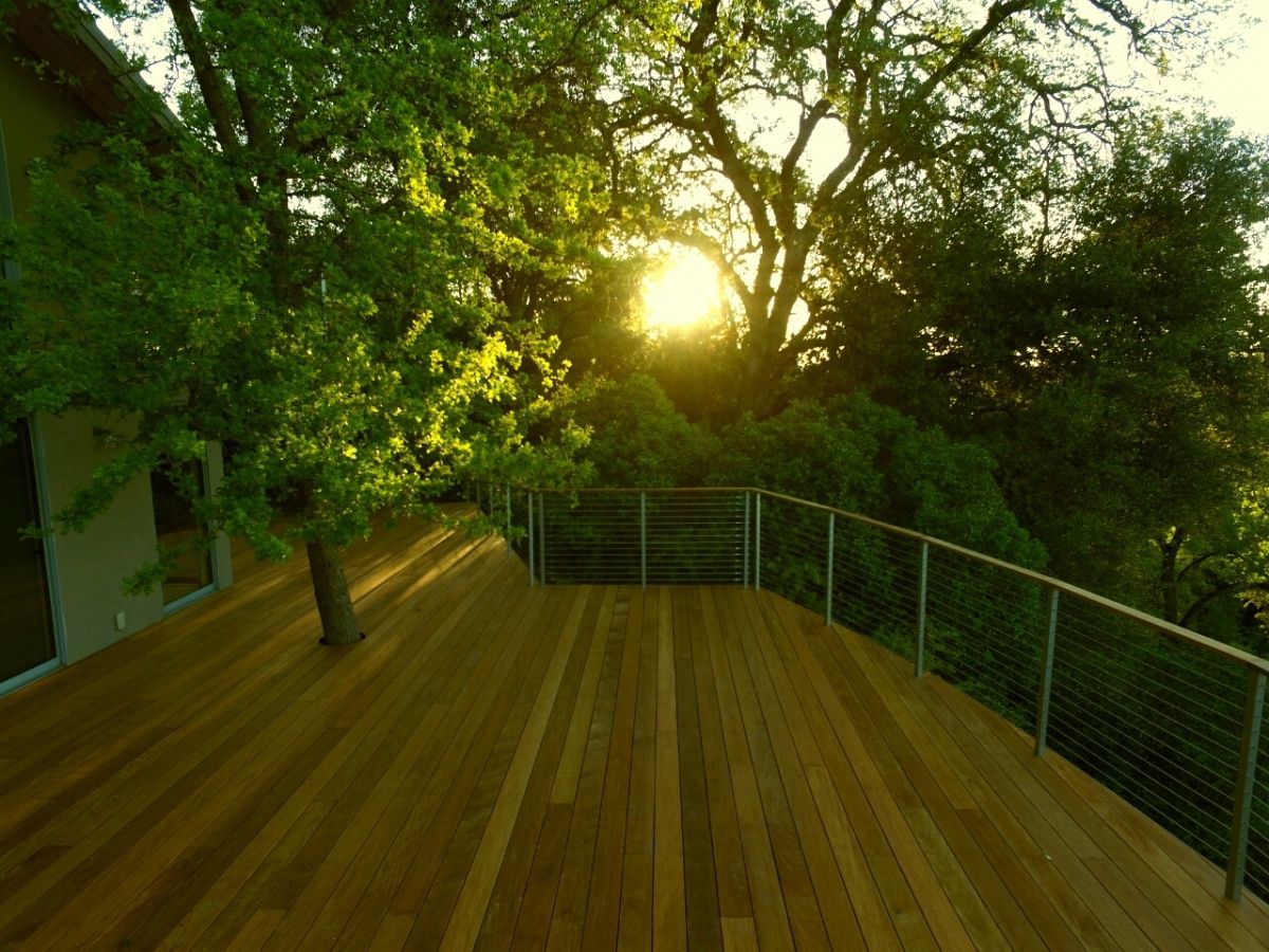 wood deck installation with tree growing through it