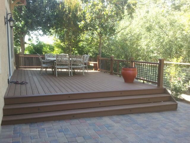 light wood decking for patio with light color railing