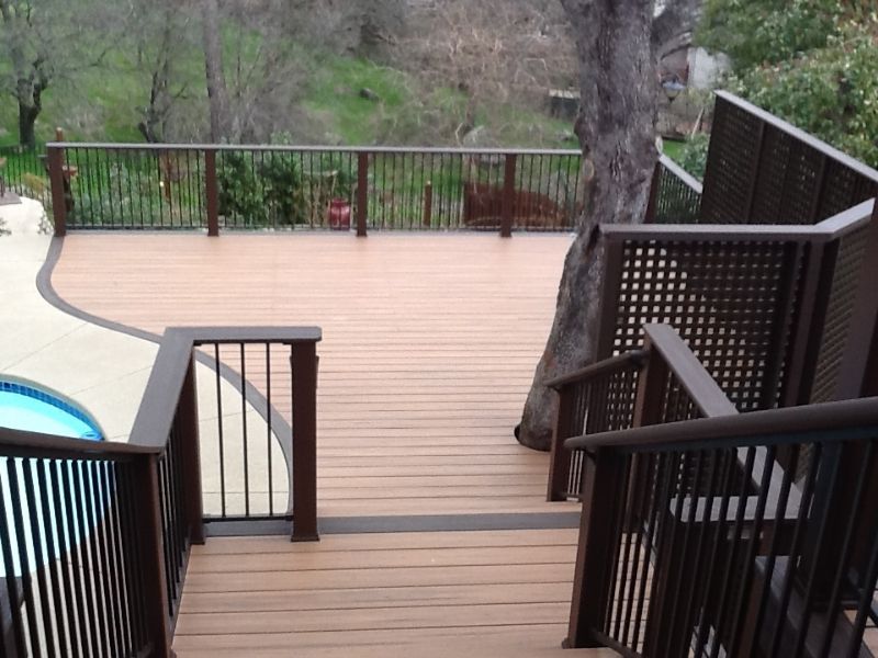 multi level deck system with new dark wood railing