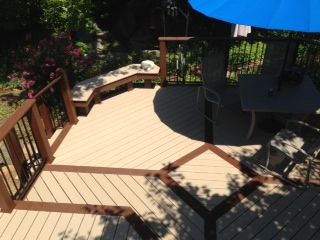 new accent colored deck with built in bench seating