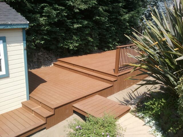 new deck with steps leading to walkway