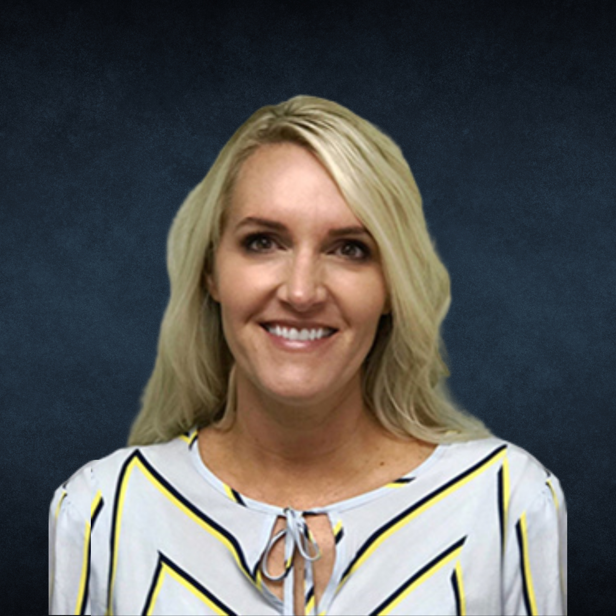 A woman in a striped shirt is smiling for the camera