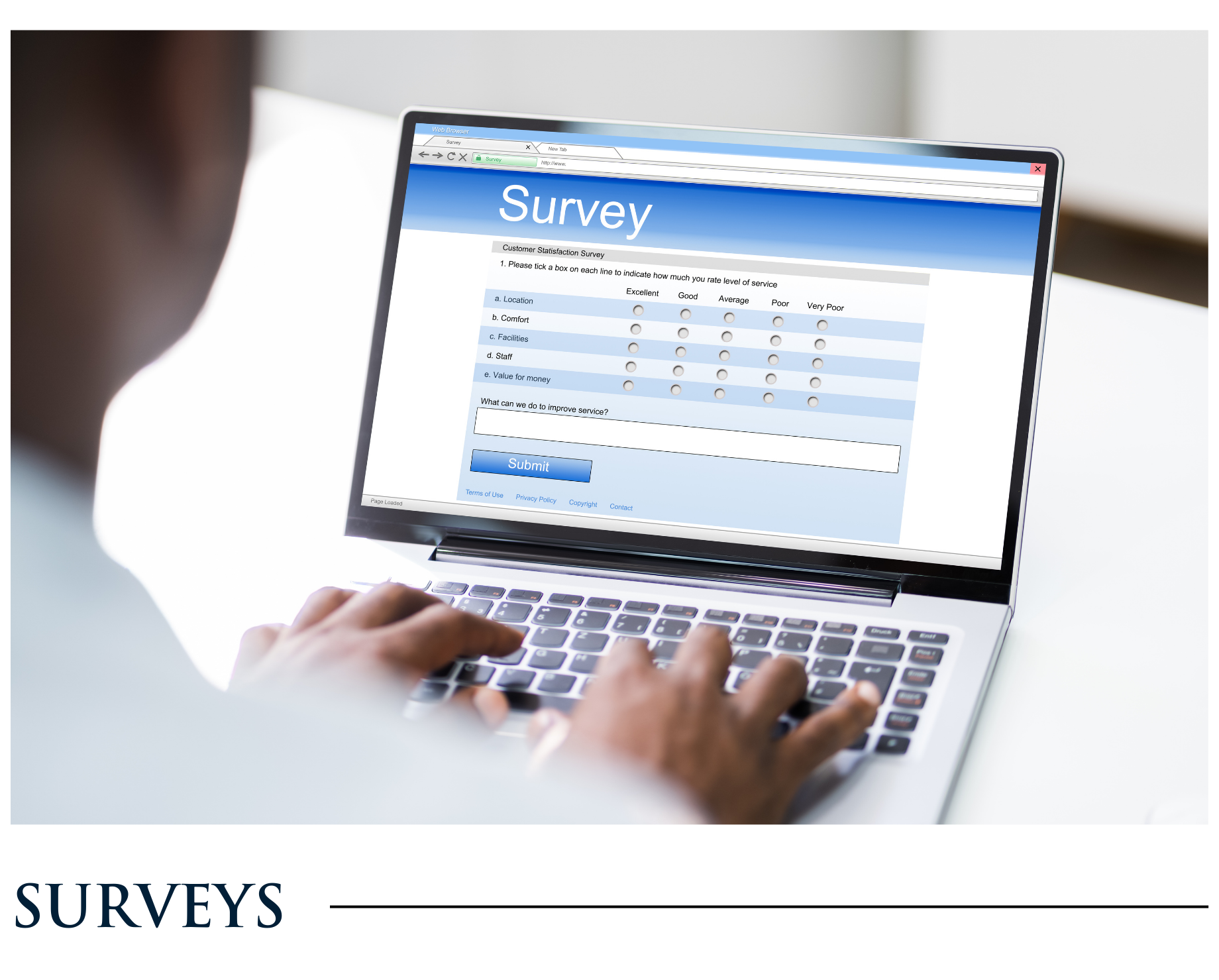 A person is typing on a laptop with a survey on the screen.