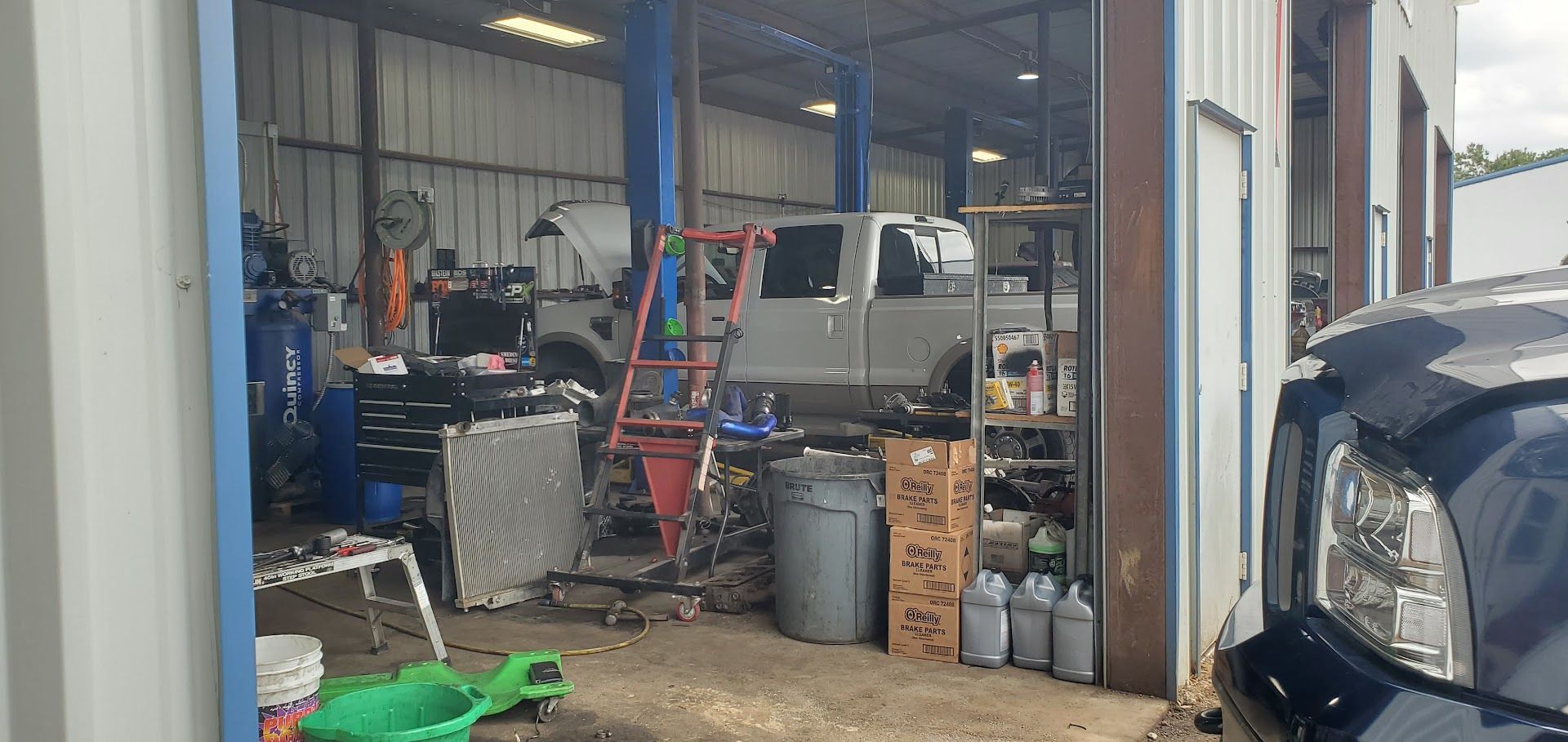 Diesel Truck Repair Bay With Work Truck | Flawless Diesel Repair LLC