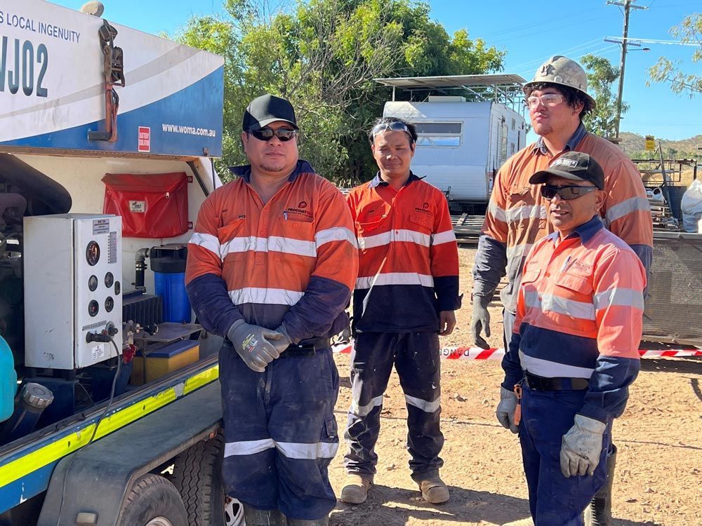 Four Procoat Workers Wearing Uniform — Procoat QLD in Ryan, QLD