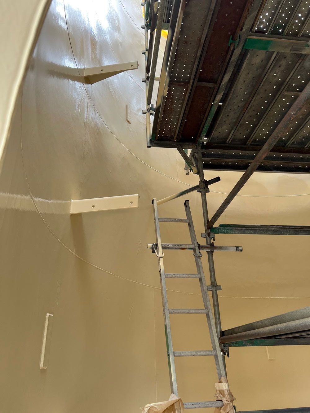 Ladder Leaning Against Scaffolding Inside a Tank — Procoat QLD in Ryan, QLD