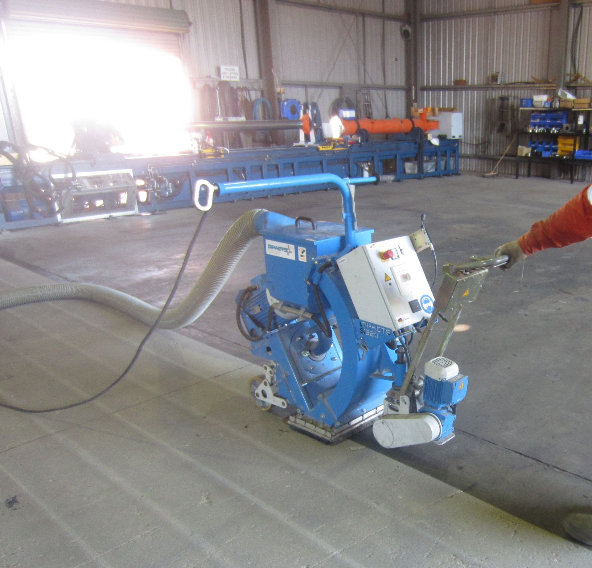 A Person is Using a Machine That Has The Number 6 on it — Procoat QLD in Ryan, QLD