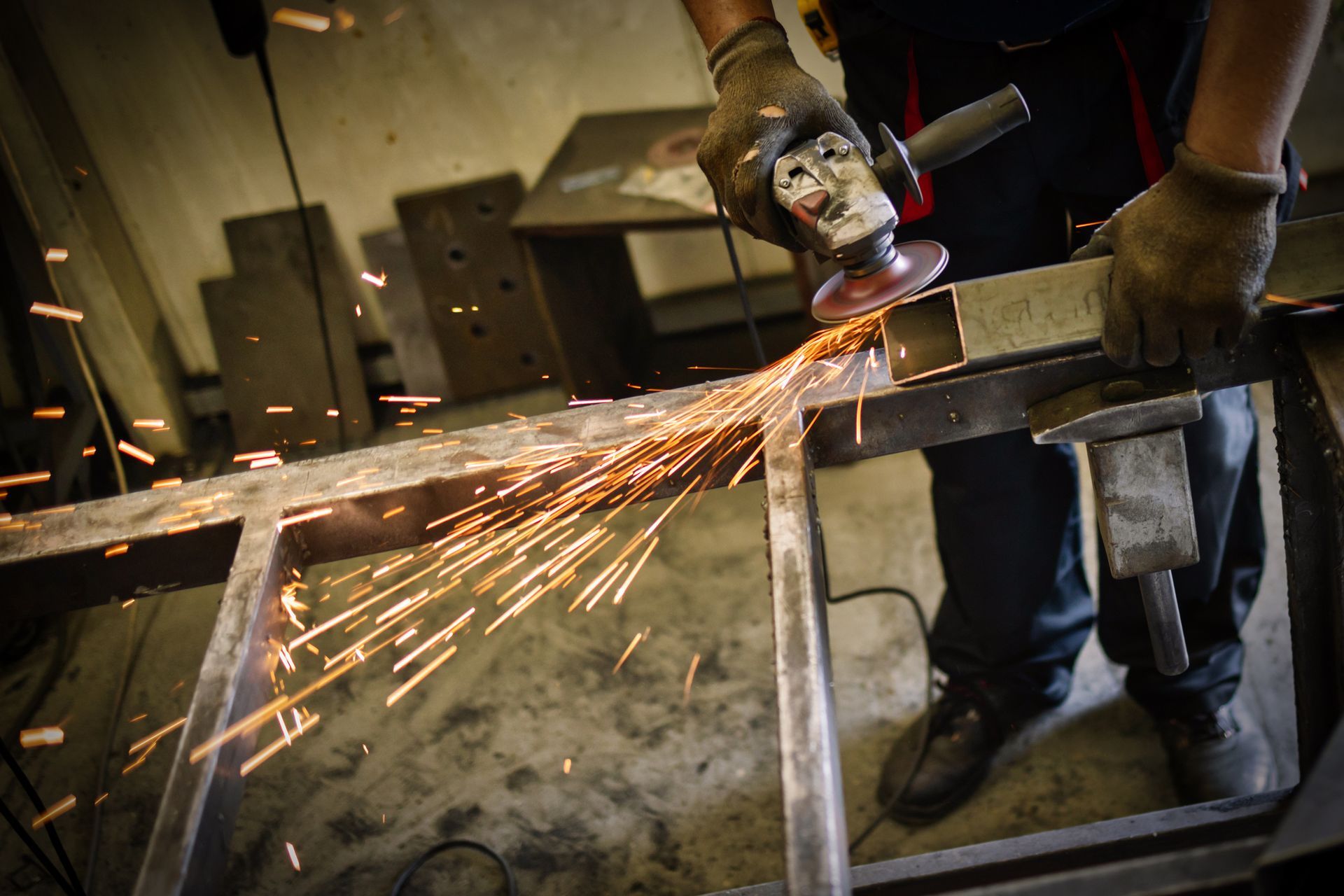 Person grinding metal, Person grinding metal