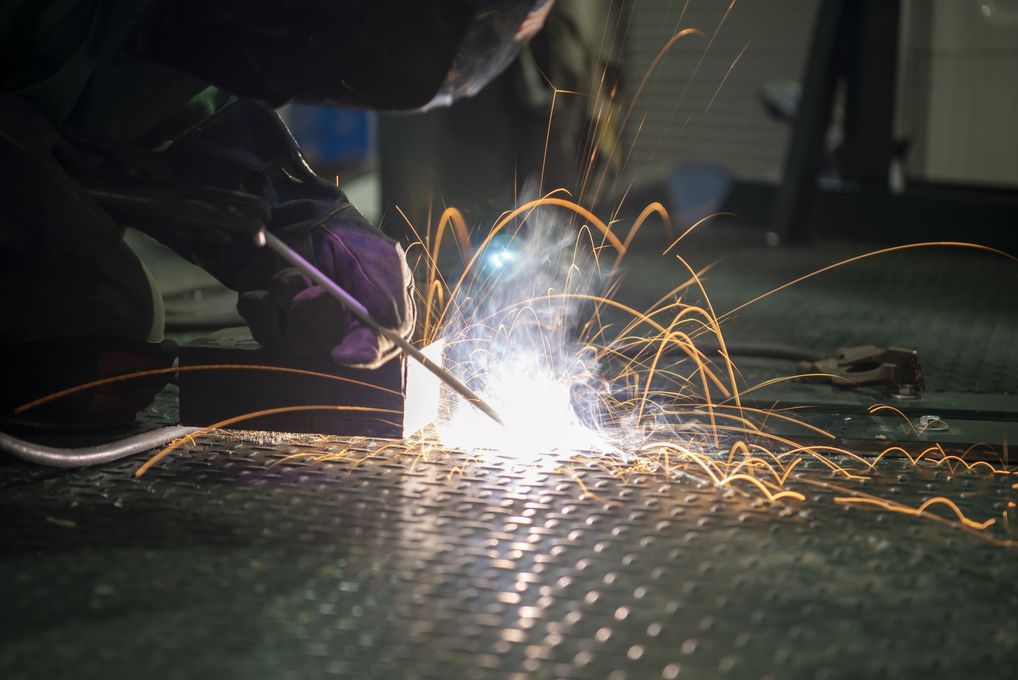 Person welding metal Person welding metal