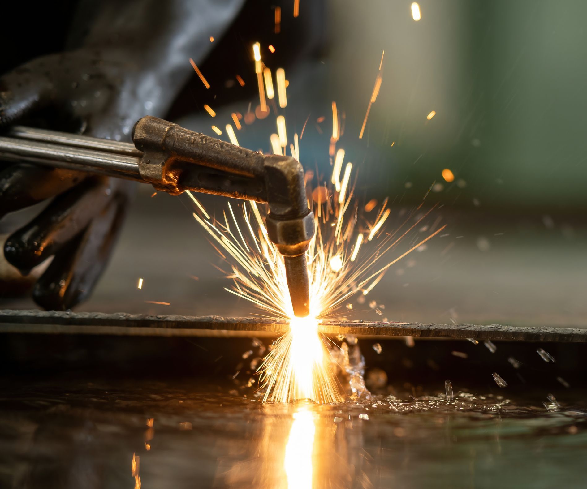 Metal is being welded with a torch Metal is being welded with a torch