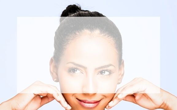 WOMAN WITH FLAWLESS SKIN SMILING