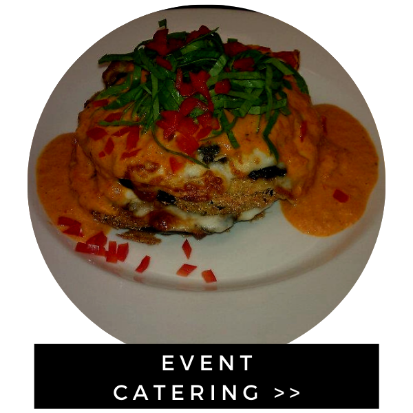 Event catering plate with stacked savory dish, red garnish, on a white plate