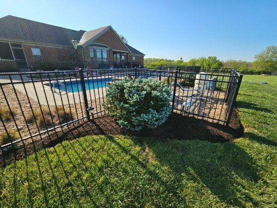 A house with a pool and a fence around it.