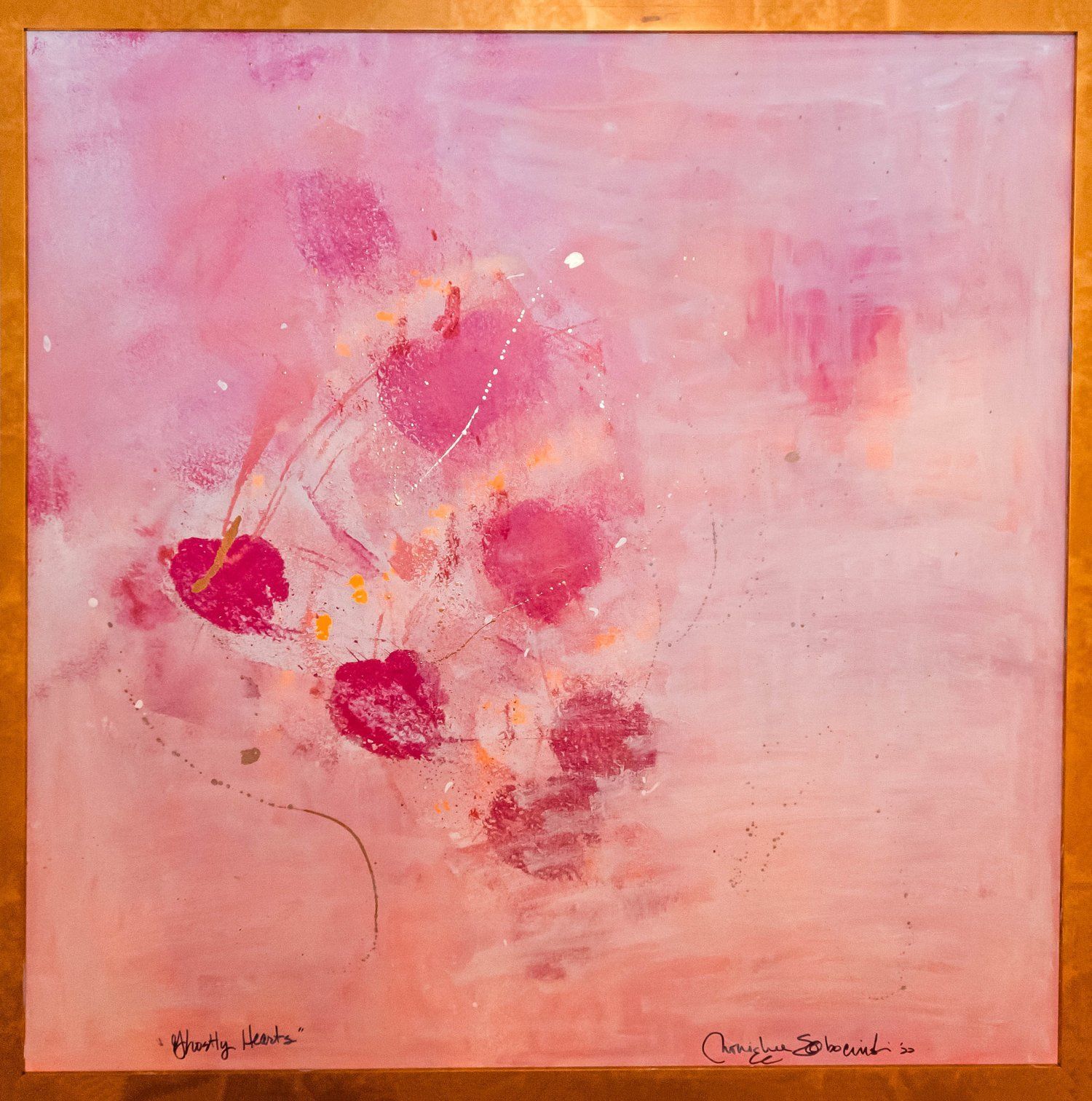 A framed painting of pink flowers with the name chris on the bottom