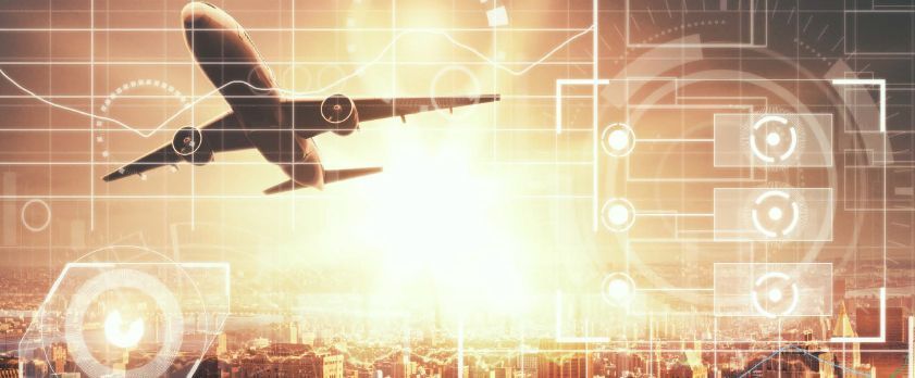 Ground crew member giving thumbs up to an airplane on the runway.