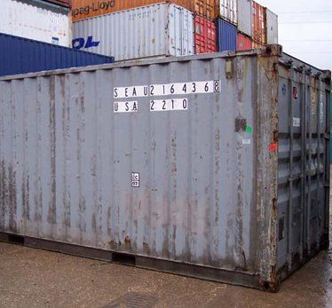Shipping container in yard.