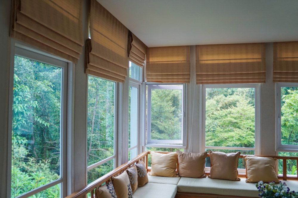 Brown Roman Blind Shade Curtain Tree Forest Mountain And Living Room — Quality Window Coverings in Mollymook, NSW