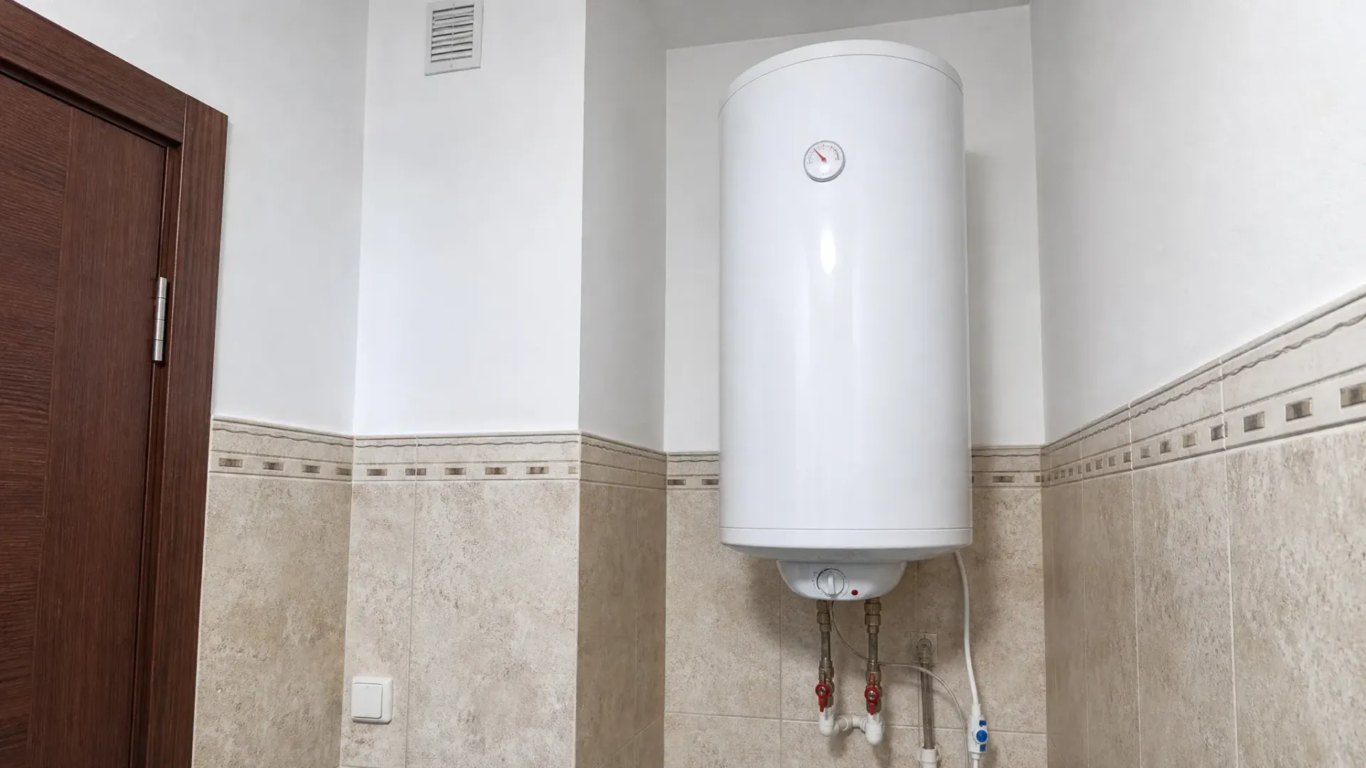 Water heater being repaired by English speaking plumber in the Algarve