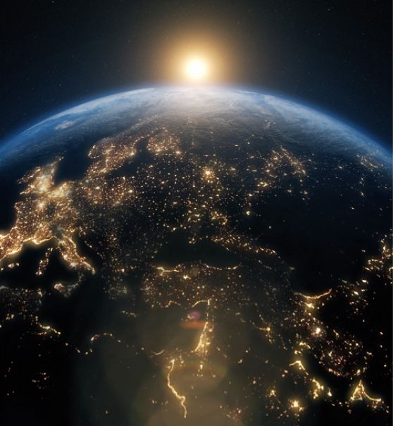 A woman with a braided ponytail is standing in front of a blue sky.