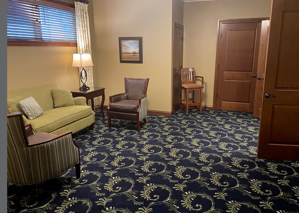 A room with a lot of chairs and a couch