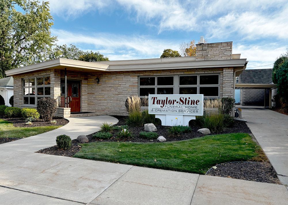 A house with a sign in front of it that says taylor mine