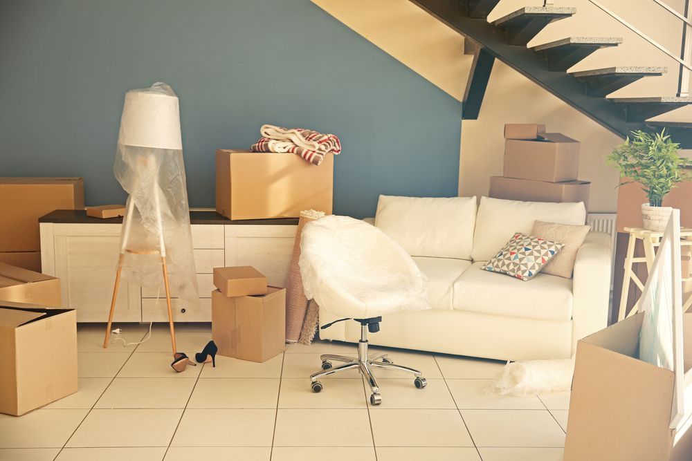Boxes and Furniture in a Room, Indicating a Move — Uplift Removals in Gold Coast, QLD