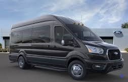 Black Ford Transit van parked outdoors.