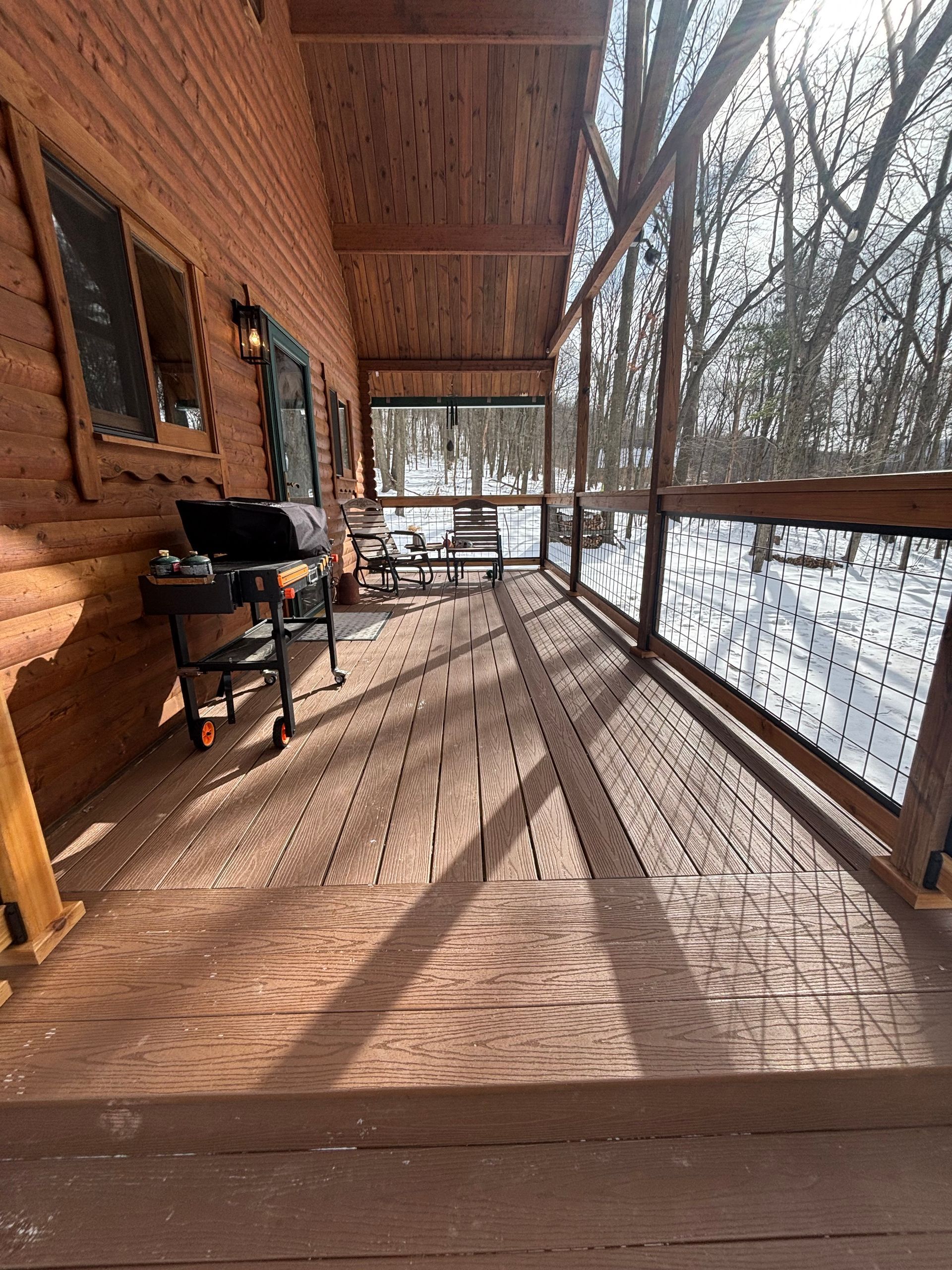 A new deck on a cabin in PA installed by DreamAway Exteriors.