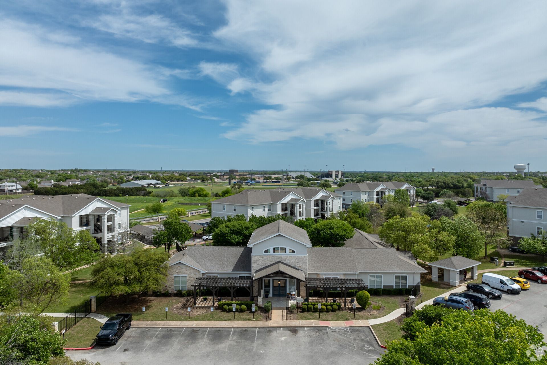 An aerial view of a residential area with lots of houses and trees.