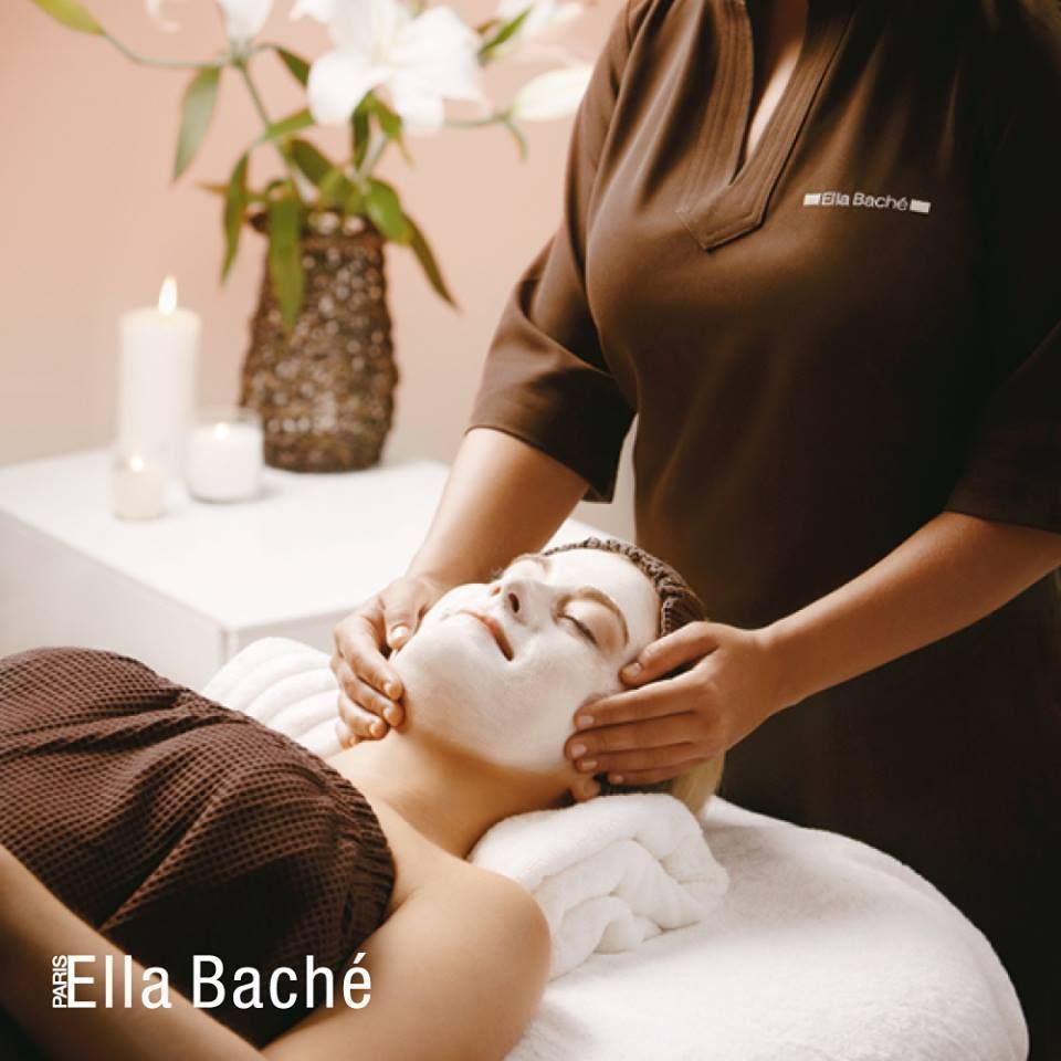 Woman receiving facial treatment at a spa.