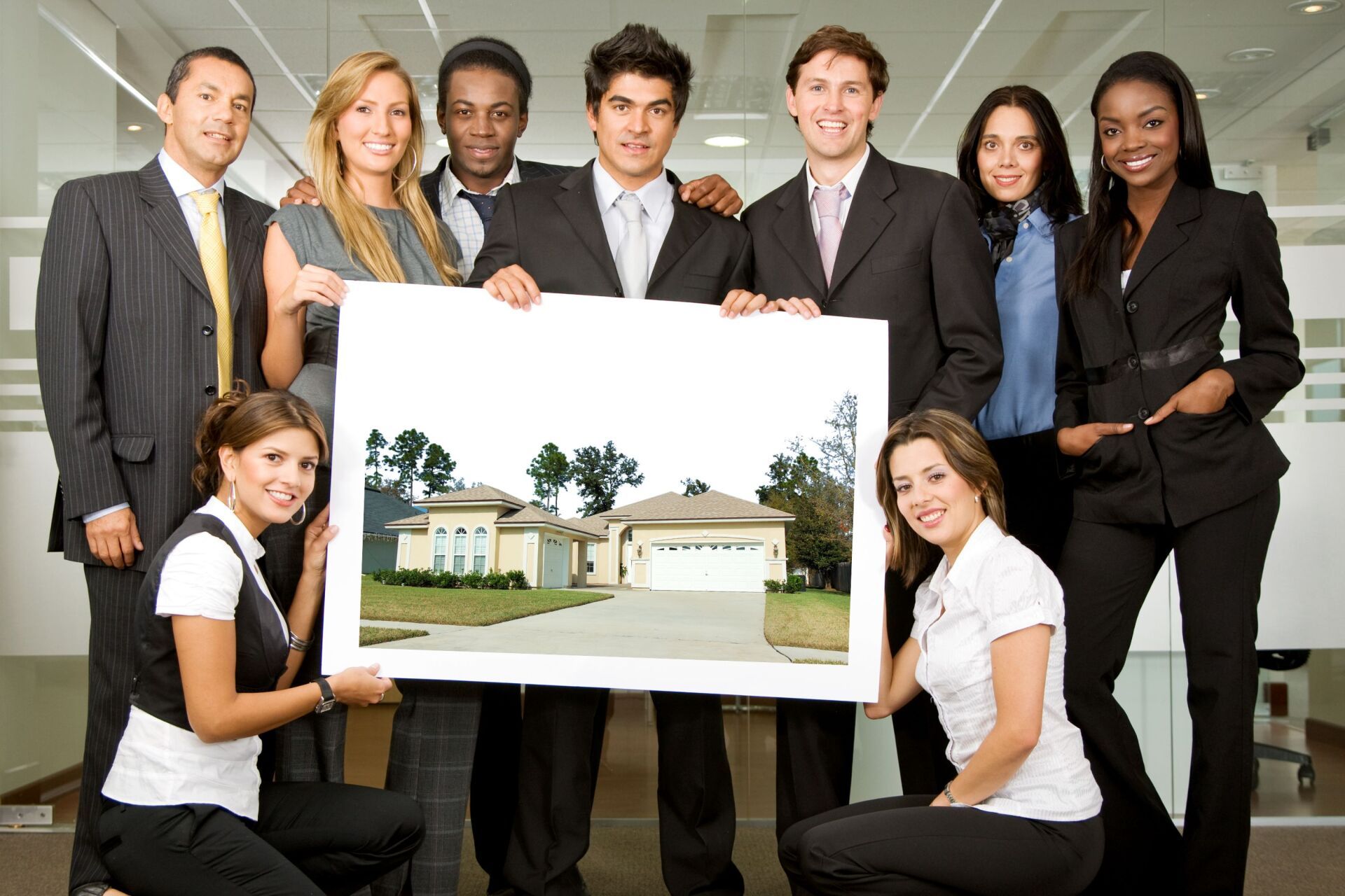 Team of investors holding up a picture of a Florida home.