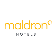 A yellow and black logo for maldron hotels