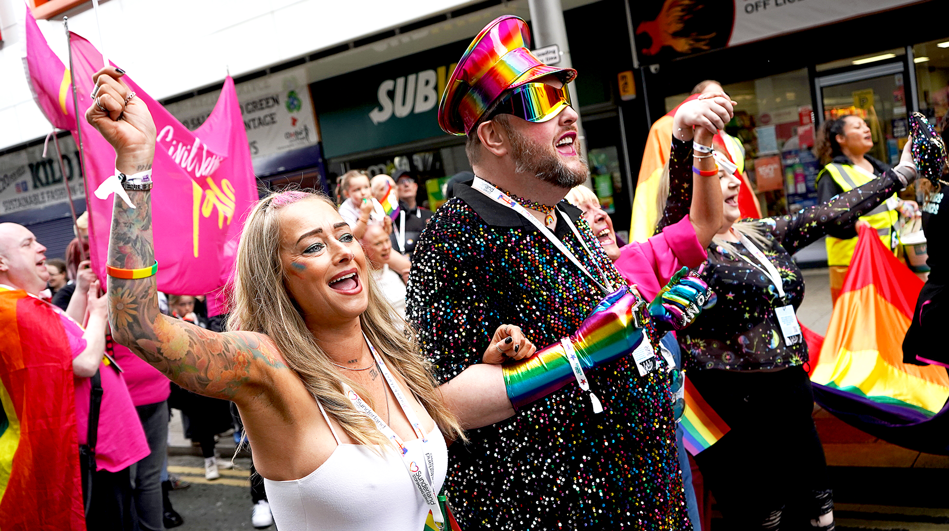 A group of people are dancing in a parade.