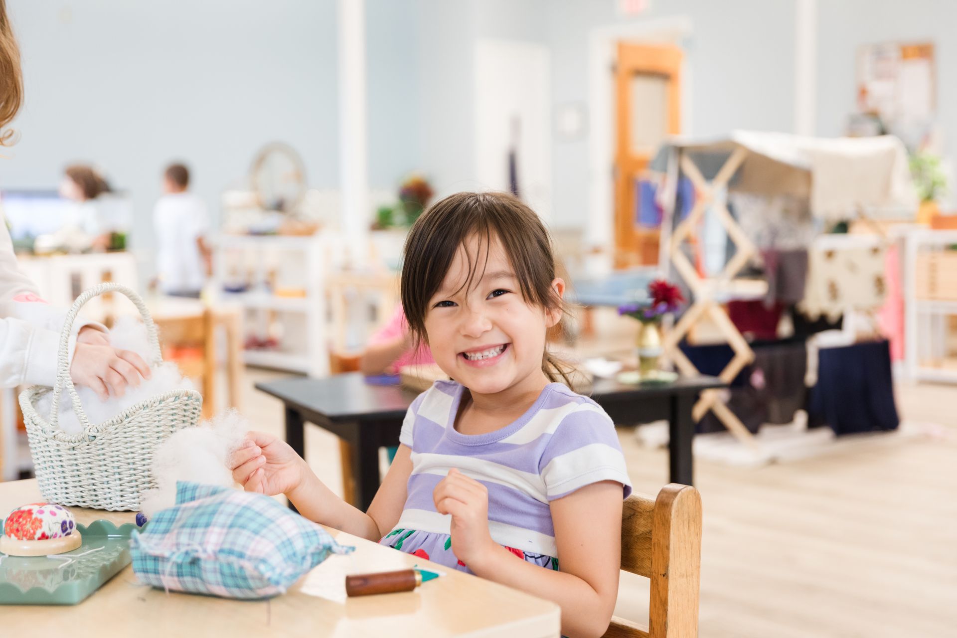 montessori primary child working with craft activity